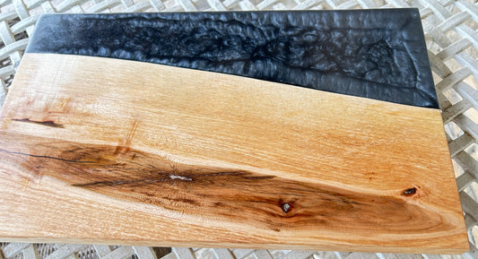 Wooden board with black resin finish
