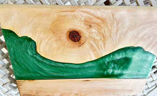 Wooden cutting board with green resin inlay