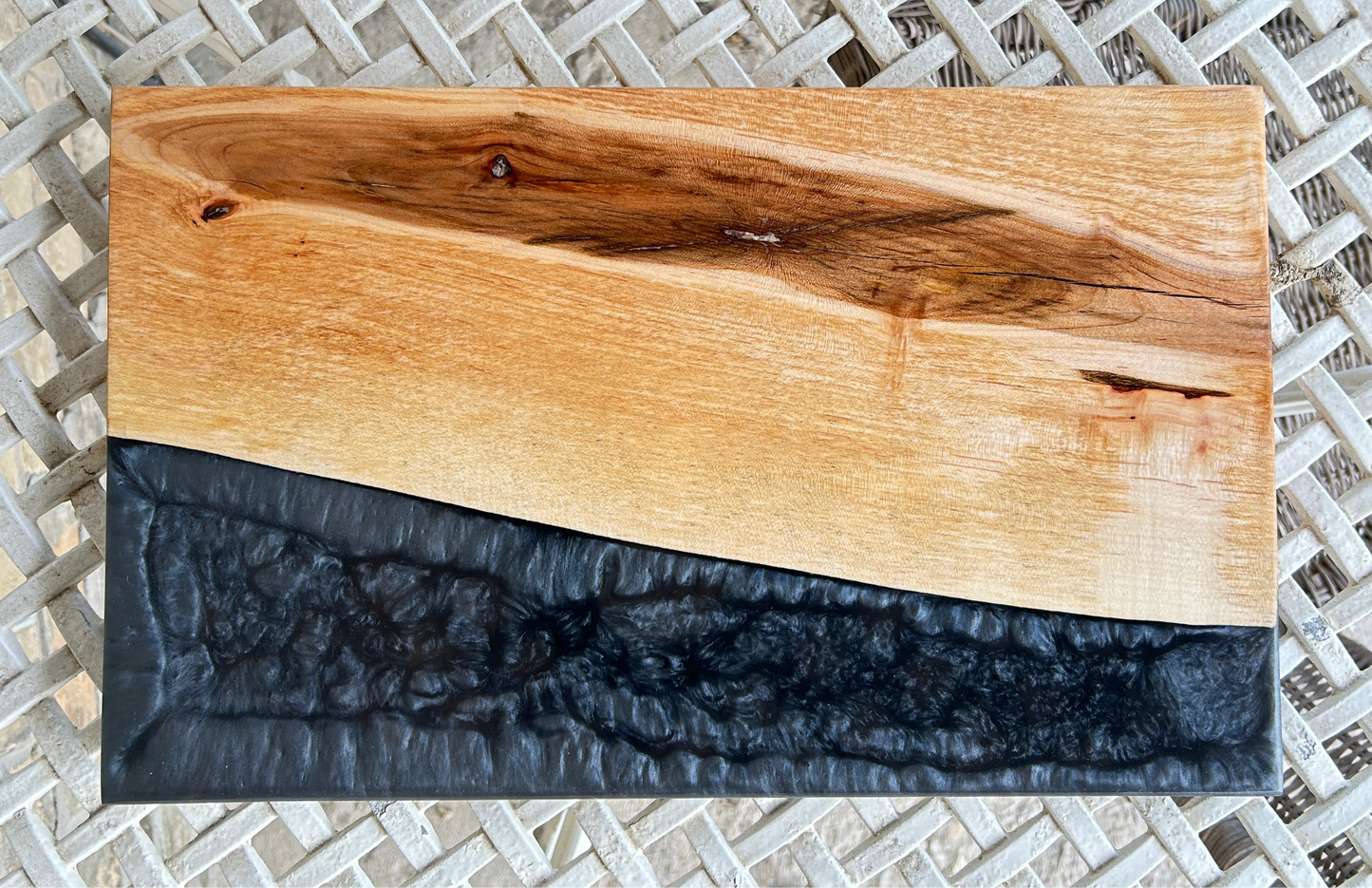 Wooden cutting board with black resin finish