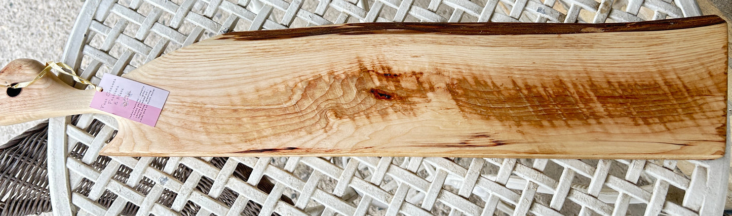 Wooden cutting board with handle and copper ring