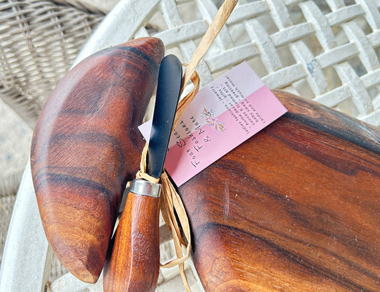 Wooden cutting board with knife