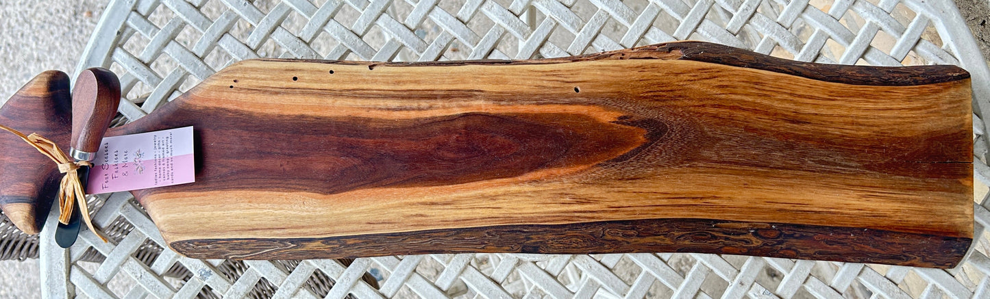 Wooden cutting board with a live edge