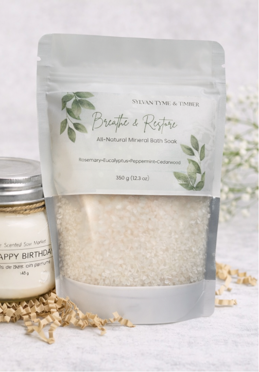 Package of all-natural mineral bath soaks with a jar of soap on a light background