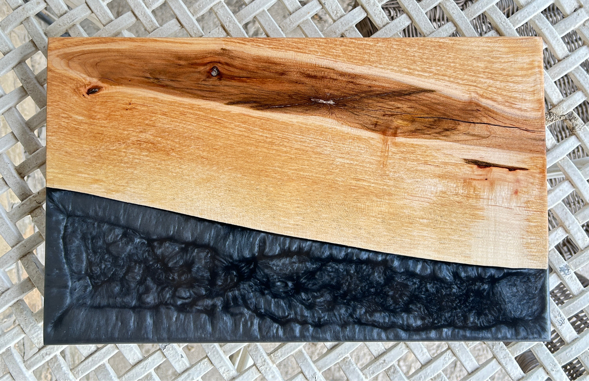 Wooden cutting board with black resin finish