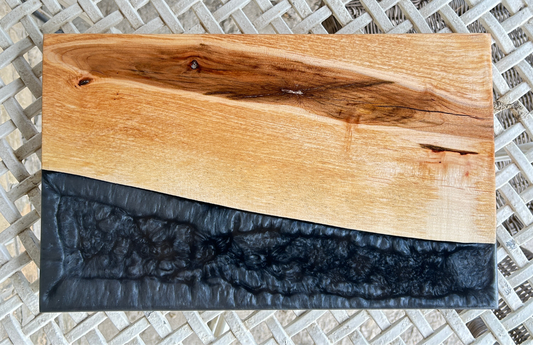Wooden cutting board with black resin finish