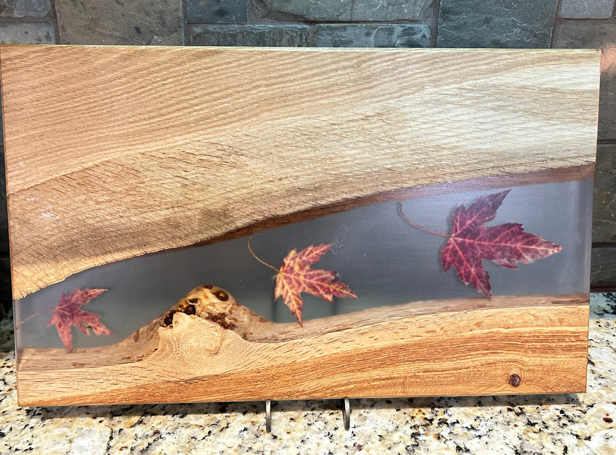 maple leaves inside clear epoxy and oak wood