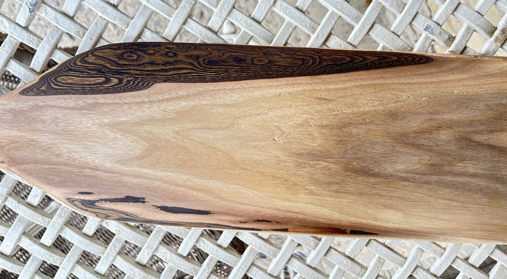 Wooden cutting board with a natural edge