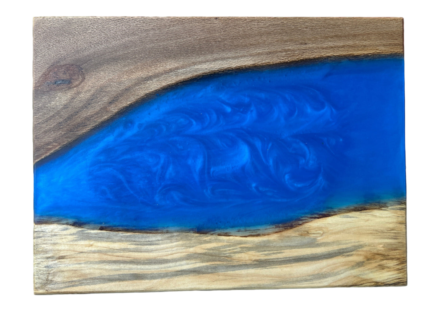 Wooden block with blue resin inlay and intricate design